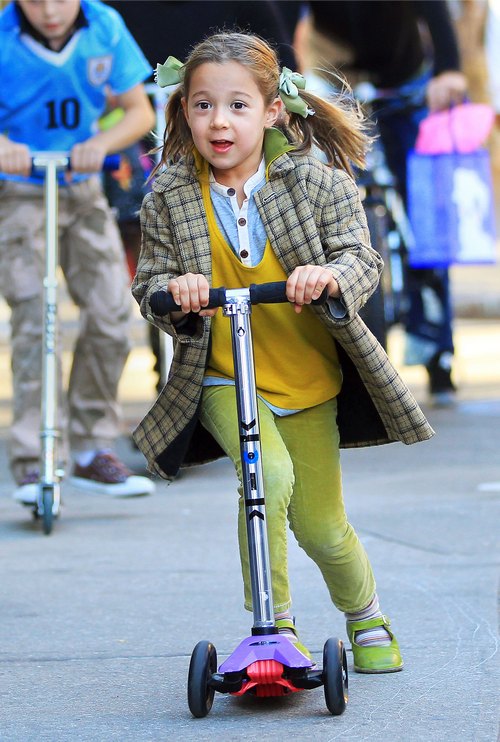Ava Jackman, scooter, yellow sweater, green hair bows
